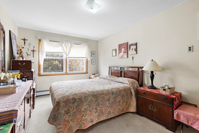 bedroom featuring light colored carpet and baseboard heating