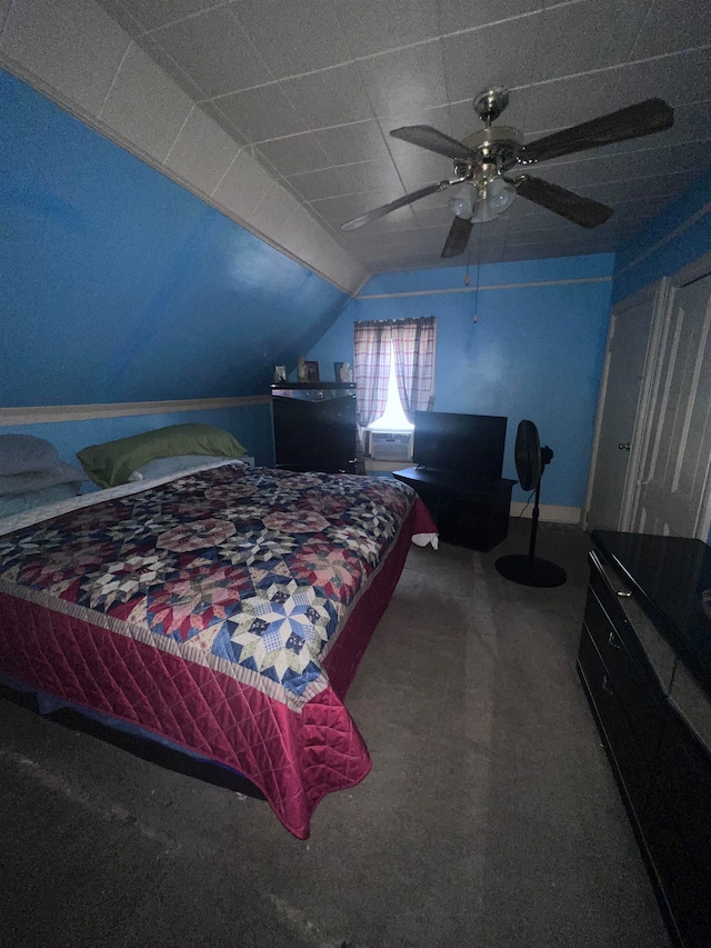 bedroom with carpet, ceiling fan, and vaulted ceiling