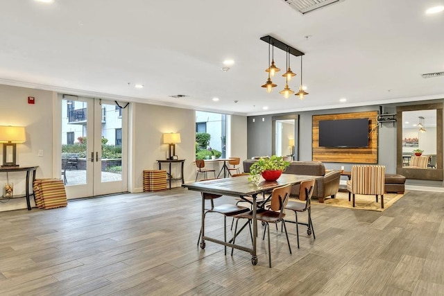 1200 Grand St Unit 220, Hoboken, NJ 07030 - dining space with crown molding, french doors, light wood-style flooring, and recessed lighting
