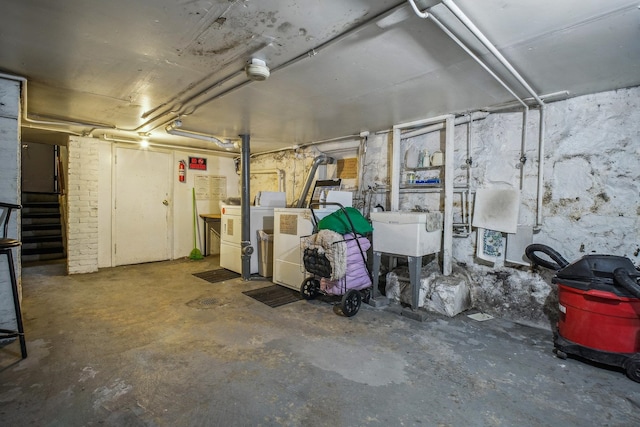 basement with washing machine and clothes dryer