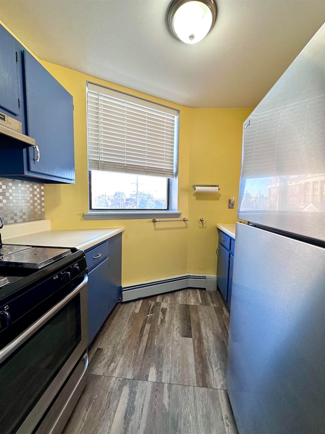 kitchen featuring a baseboard heating unit, stainless steel appliances, and blue cabinets