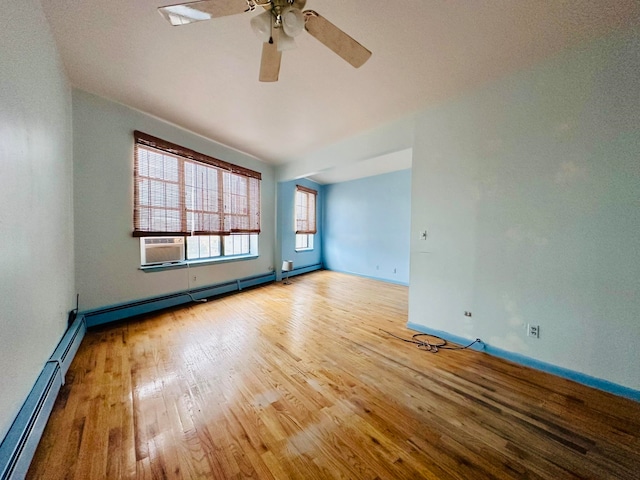 unfurnished room with light hardwood / wood-style floors, ceiling fan, cooling unit, and a baseboard heating unit