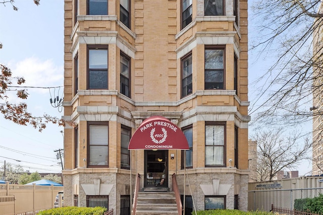 view of building exterior featuring fence