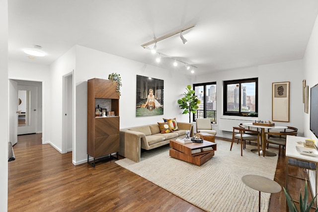 205 10th St Unit 9W, Jersey City, NJ 07030 - living area featuring wood finished floors, track lighting, and baseboards