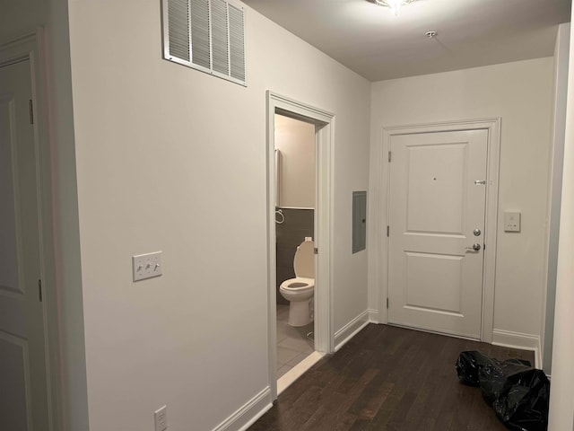 hall featuring electric panel and dark hardwood / wood-style floors