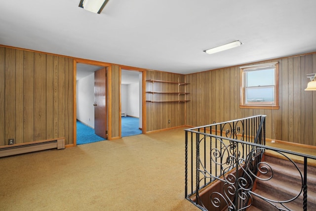 1508 77th St, North Bergen, NJ 07047 - carpeted spare room with wood walls and a baseboard radiator