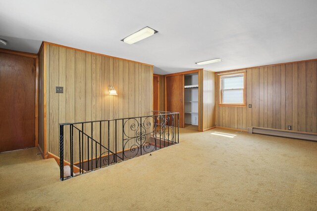 1508 77th St, North Bergen, NJ 07047 - unfurnished room with baseboard heating, carpet, and wooden walls
