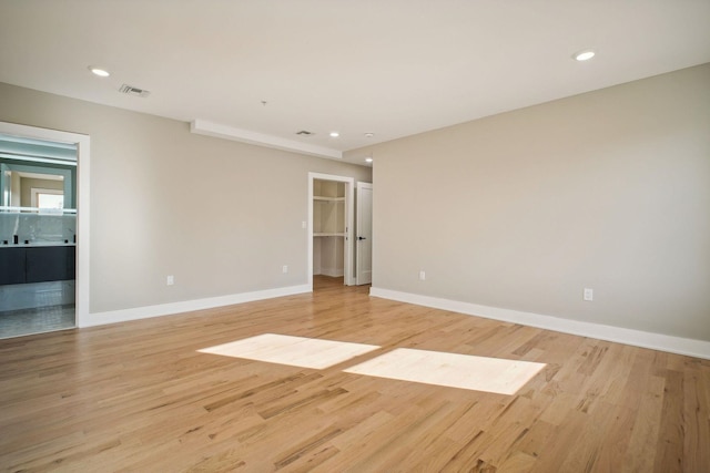 spare room featuring light wood-type flooring