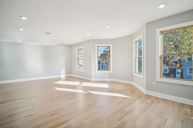 unfurnished room featuring light wood-type flooring