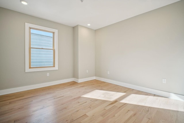 unfurnished room featuring light hardwood / wood-style floors