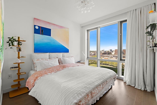 75 Park Ln S Unit 706, Jersey City, NJ 07310 - bedroom with a city view and wood finished floors