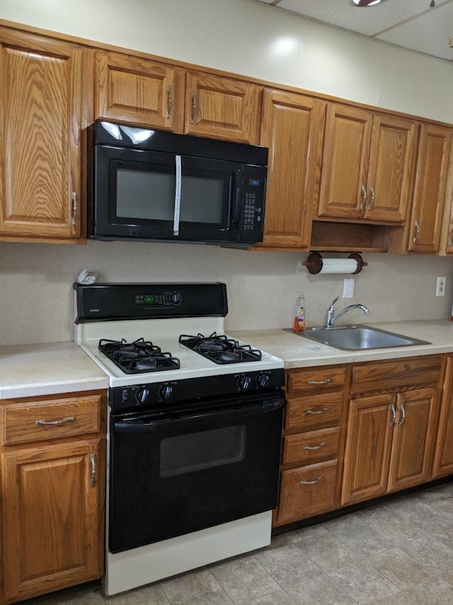 kitchen featuring sink and gas range