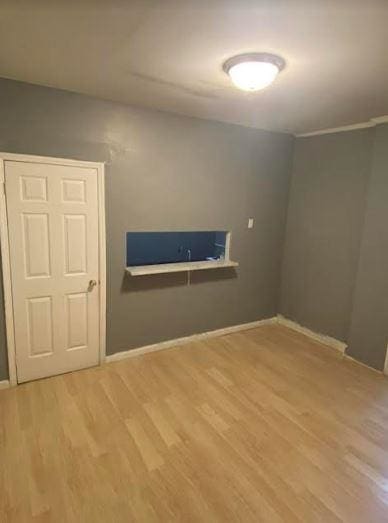 laundry room with hardwood / wood-style flooring