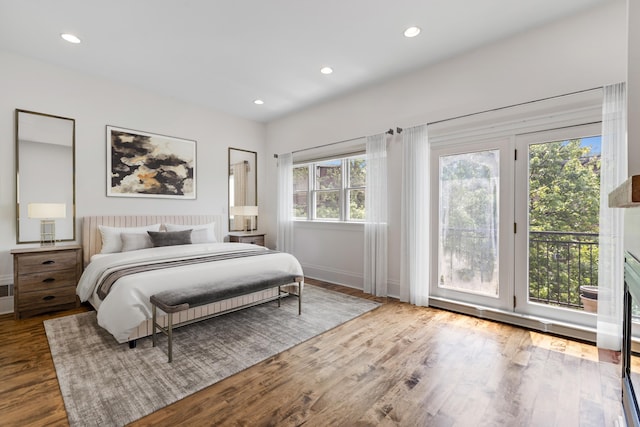 297 Montgomery St Unit 2, Jersey City, NJ 07302 - bedroom featuring access to exterior, wood finished floors, and recessed lighting