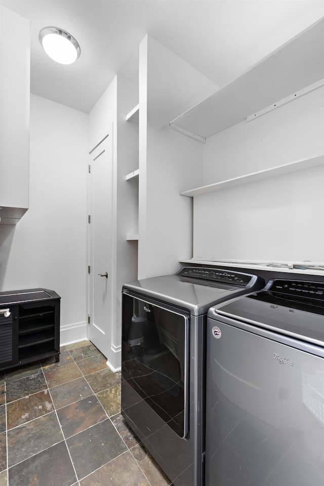 297 Montgomery St Unit 2, Jersey City, NJ 07302 - washroom featuring stone tile flooring and washing machine and clothes dryer
