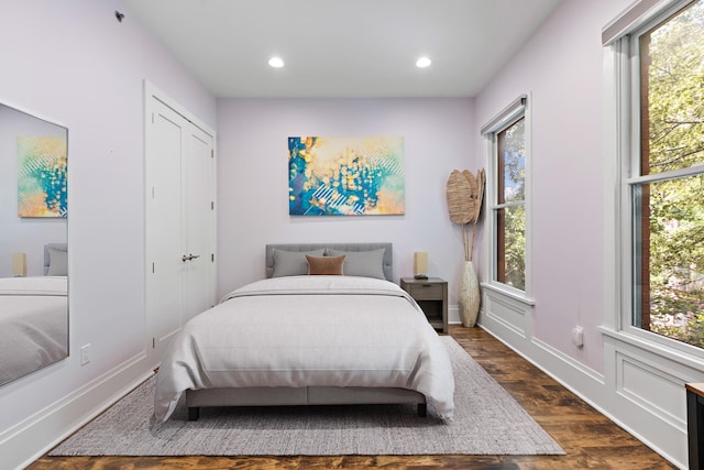 297 Montgomery St Unit 2, Jersey City, NJ 07302 - bedroom with dark wood-type flooring, multiple windows, and recessed lighting