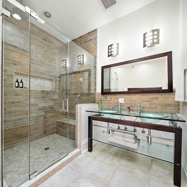 297 Montgomery St Unit 2, Jersey City, NJ 07302 - full bathroom with double vanity, a stall shower, and tile patterned flooring