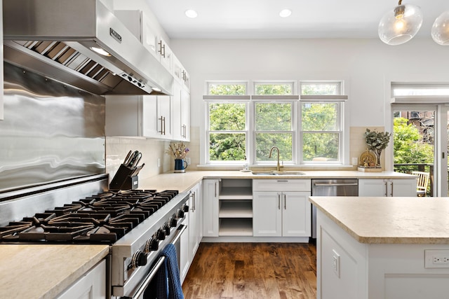 297 Montgomery St Unit 2, Jersey City, NJ 07302 - kitchen with exhaust hood, stainless steel appliances, healthy amount of natural light, decorative backsplash, and recessed lighting