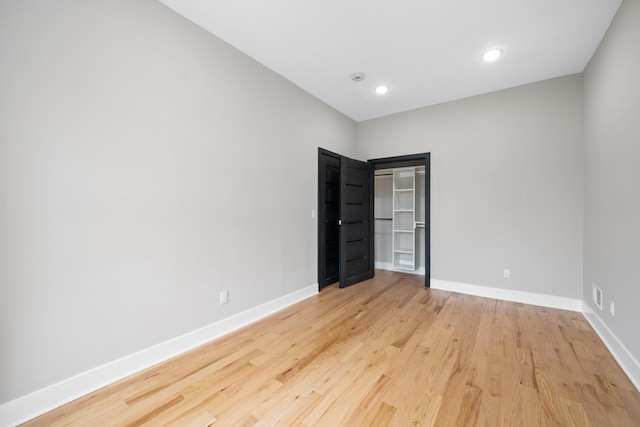 unfurnished bedroom with light wood-type flooring