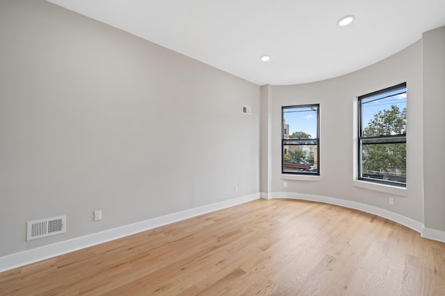 spare room featuring light hardwood / wood-style floors