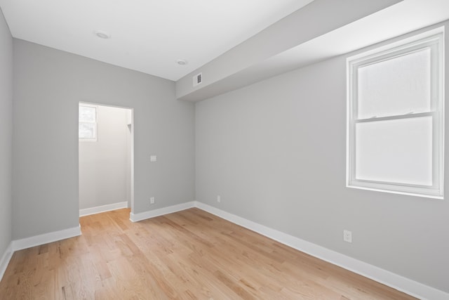 unfurnished room featuring light hardwood / wood-style floors