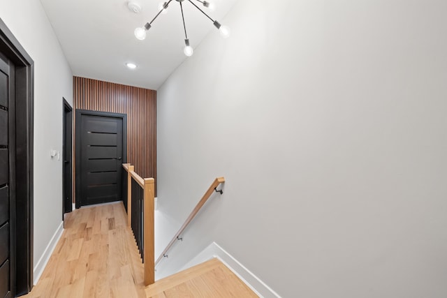 corridor with light hardwood / wood-style flooring