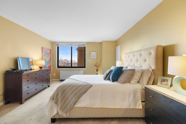 bedroom featuring light carpet