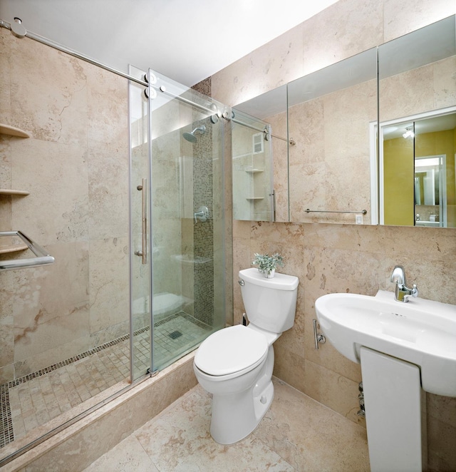 bathroom featuring toilet, tile walls, tasteful backsplash, and walk in shower