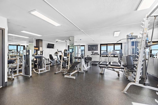 exercise room featuring a textured ceiling