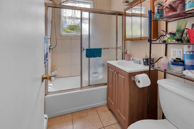 280 Highland Ave Unit 3, Kearny, NJ 07032 - full bathroom featuring vanity, enclosed tub / shower combo, tile patterned flooring, and baseboard heating