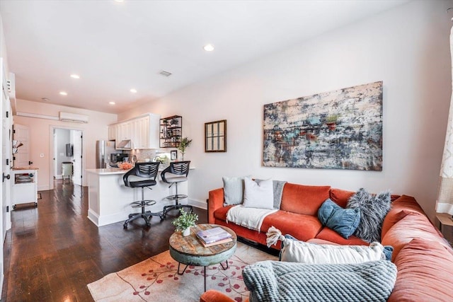351 5th St Unit 3, Jersey City, NJ 07302 - living room featuring a wall mounted air conditioner, dark wood finished floors, recessed lighting, and baseboards