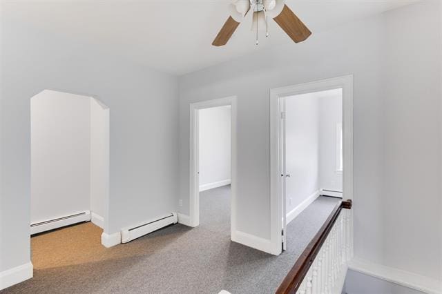 1406 8th St Unit 2, North Bergen, NJ 07047 - carpeted empty room featuring a baseboard radiator, a baseboard heating unit, ceiling fan, and baseboards