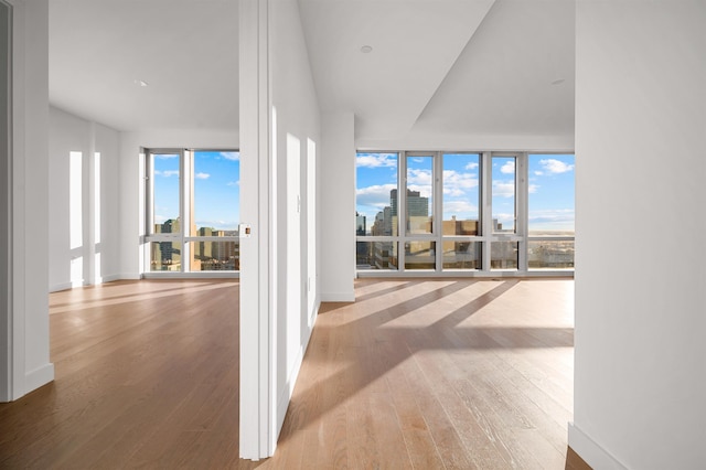 75 Park Ln S Unit 1912, Jersey City, NJ 07310 - hall with wood finished floors, a view of city, and baseboards