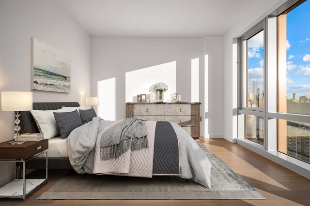 75 Park Ln S Unit 1912, Jersey City, NJ 07310 - bedroom with wood finished floors