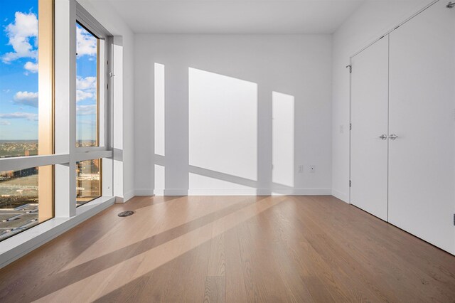 75 Park Ln S Unit 1912, Jersey City, NJ 07310 - empty room featuring wood finished floors and baseboards