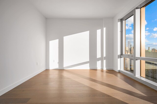 75 Park Ln S Unit 1912, Jersey City, NJ 07310 - empty room with wood finished floors and baseboards