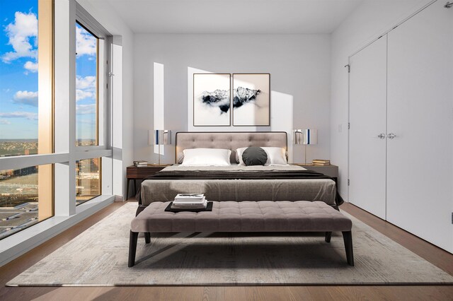 75 Park Ln S Unit 1912, Jersey City, NJ 07310 - bedroom with wood finished floors