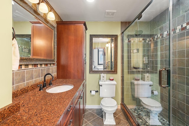 bathroom featuring visible vents, backsplash, a stall shower, and toilet