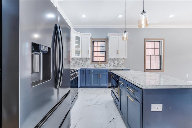 kitchen featuring white cabinets, glass insert cabinets, appliances with stainless steel finishes, marble finish floor, and blue cabinetry