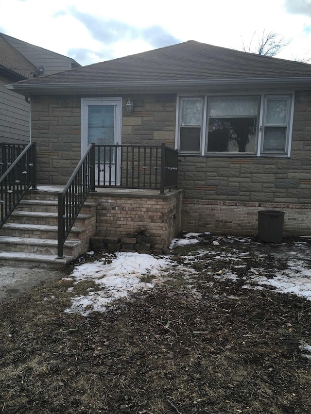 view of snow covered property entrance