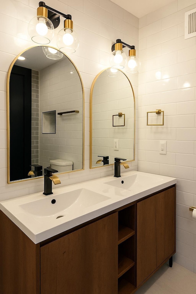 141 Sherman Ave Unit 2, Jersey City, NJ 07307 - bathroom with double vanity and tile walls