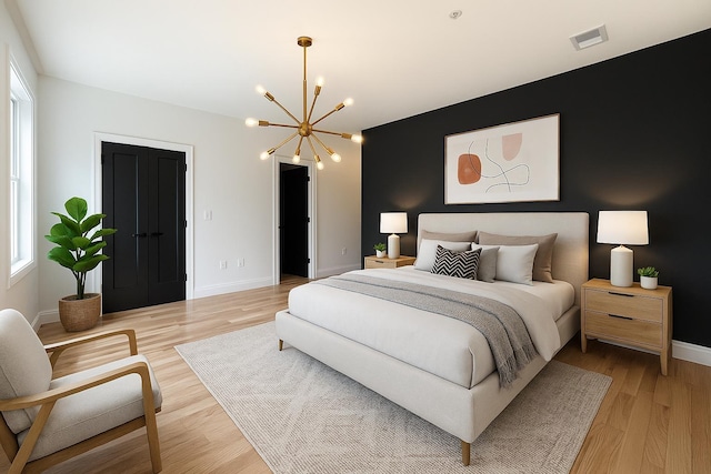 141 Sherman Ave Unit 2, Jersey City, NJ 07307 - bedroom featuring a chandelier and light wood-type flooring