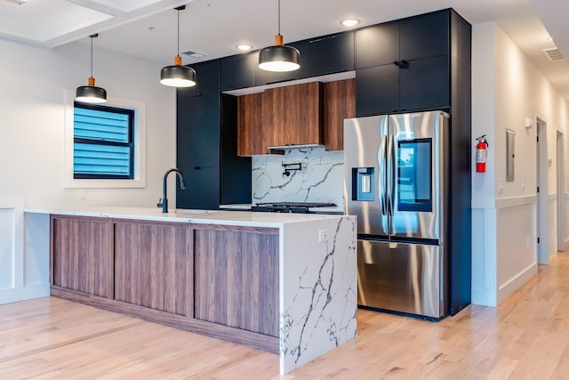 141 Sherman Ave Unit 2, Jersey City, NJ 07307 - kitchen with stainless steel refrigerator with ice dispenser, modern cabinets, light wood-style floors, a peninsula, and backsplash