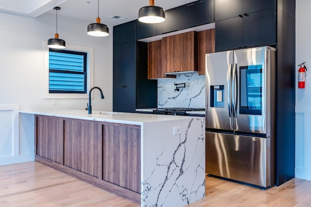 141 Sherman Ave Unit 2, Jersey City, NJ 07307 - kitchen featuring stainless steel fridge with ice dispenser, a peninsula, modern cabinets, tasteful backsplash, and light wood finished floors