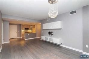 1200 Avenue At Port Imperial Unit 519, Weehawken, NJ 07086 - unfurnished living room with a chandelier and wood finished floors