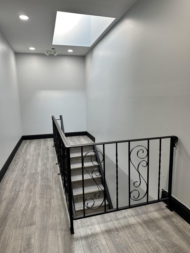 552 38th St Unit 3, Union City, NJ 07087 - stairs featuring a skylight, wood finished floors, and recessed lighting