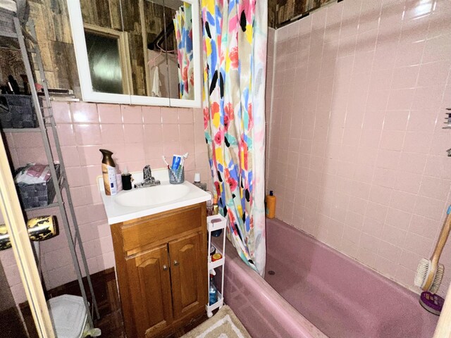 552 38th St Unit 3, Union City, NJ 07087 - bathroom with shower / bath combo with shower curtain, vanity, and tile walls