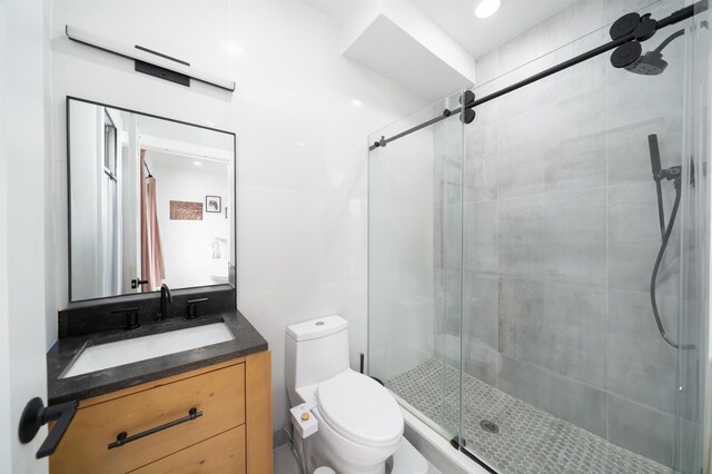 109 Poplar St Unit 1, Jersey City, NJ 07307 - bathroom featuring a shower stall, toilet, and vanity