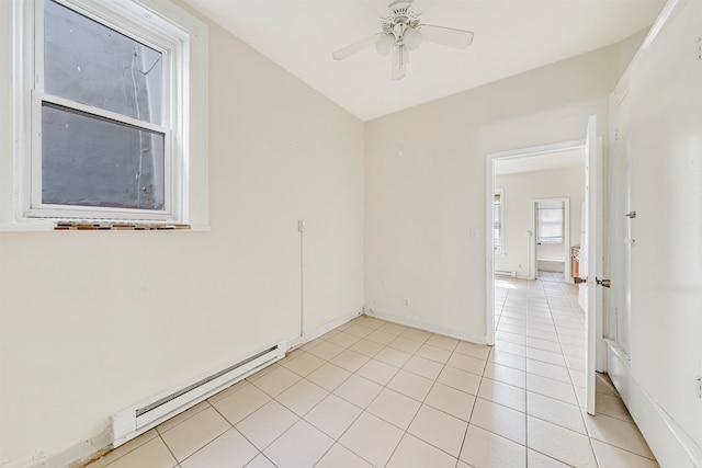 unfurnished room featuring ceiling fan, a baseboard radiator, and light tile patterned floors