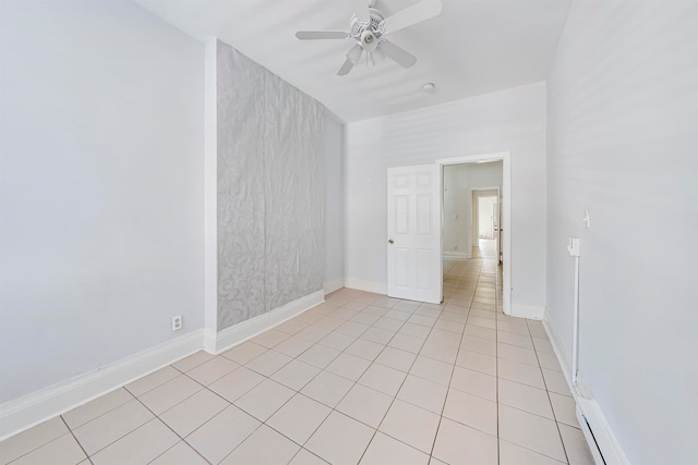 tiled empty room with ceiling fan